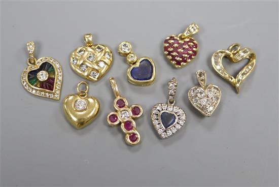 Nine assorted modern gem set pendants, one 18ct gold, seven yellow metal and one white and yellow metal.